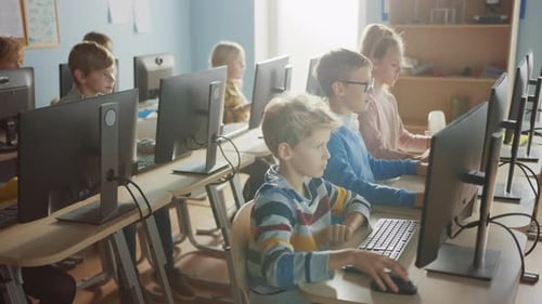 Elementary School Computer Science Classroom: Diverse Group of Little Smart Schoolchildren using Pe