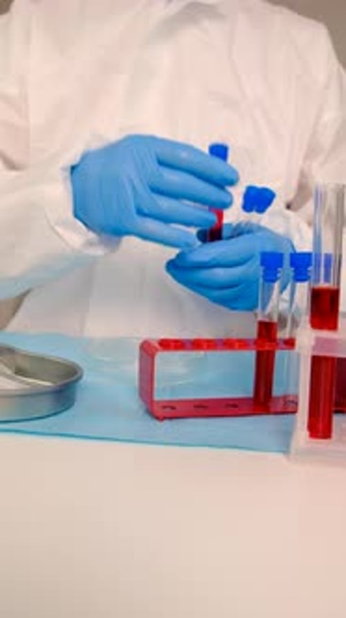 Lab Technician Working with Test Tubes