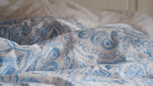 Close Up of Decorative Bedding with Blue Pattern