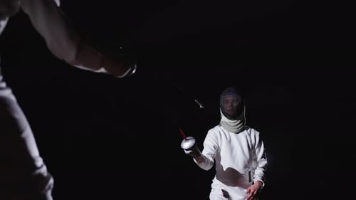 Fencer Attacking Opponent And Making Touche Slow Motion Shot Of Fighting Of Two Swordsmen