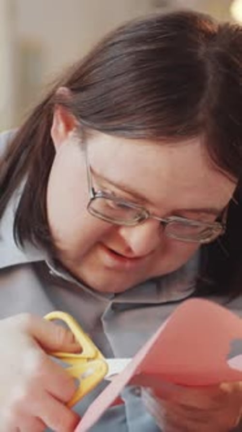 Adult Crafting, Cutting Paper with Scissors Close Up