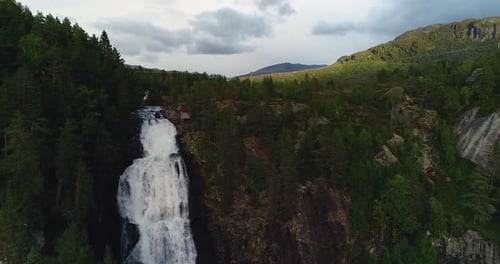 Majestic Waterfall Cascades in Lush Mountain Landscape