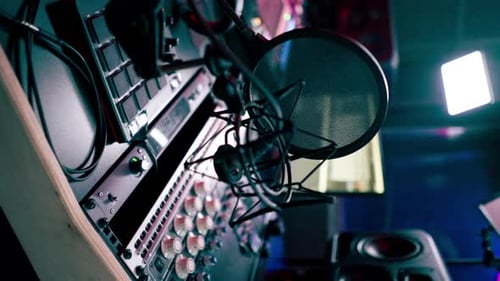Vertical Video Close Up the Recording Room is Dark with Neon Lighting Prorecording Remote Control