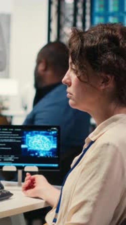 Vertical Video Office Administrator Checking Monthly Reports with AI Analytics Platform