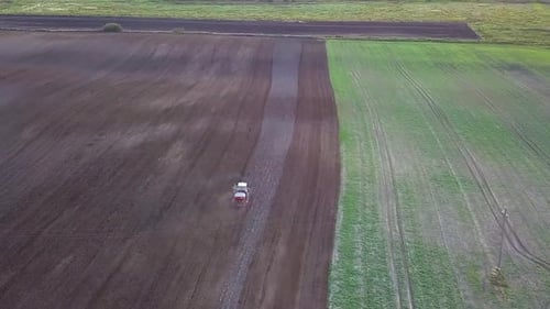 Tractor Plowing Aerial Shot. Drone Footage Of A Tractor Plowing A Field. Countryside Aerial Shot.
