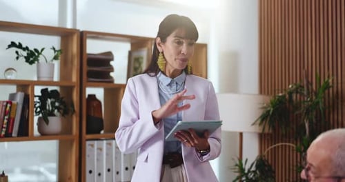Business, woman and discussion with tablet in meeting for project planning or strategy in office