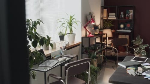 Workplace of Interior Designer with 3D Model of Chair on Laptop