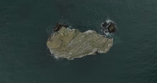 Aerial view of a rock in the sea, Iceland.