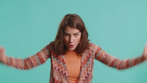 Woman Demonstrates Fighting Motions Against Isolated Background