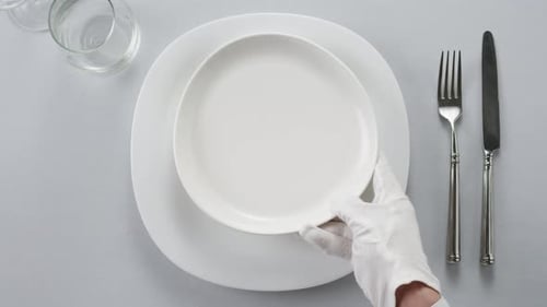 Elegant Table Setting with Plates and Silverware