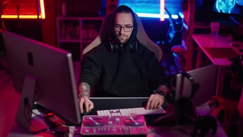 Young Adult Working at Computer at Night