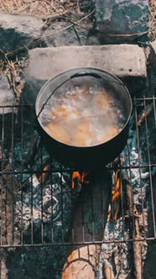 Boiling Pot Over Campfire Outdoors