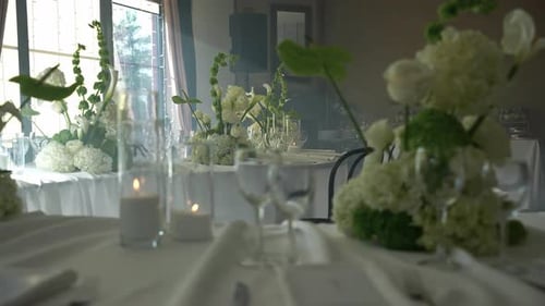 Wedding Reception Table Setting with Flowers and Candles