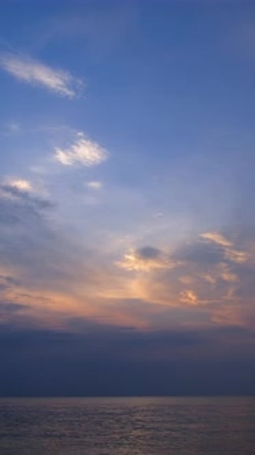 Vertical time lapse video of dramatic dawn to sunrise at a tropical beach.