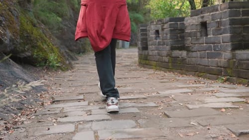 Person Walking on the Great Wall of China Path