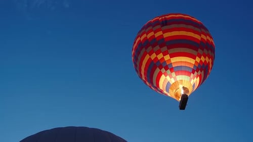 Hot Air Balloon Rising at Sunrise