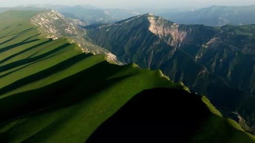 The Mountain Canyon is Covered with Green Grass A Massive Mountain Range Taken From an Aerial Survey