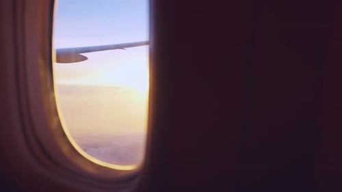 View of beautiful blue sky and sunset with cloudy outside an airplane.