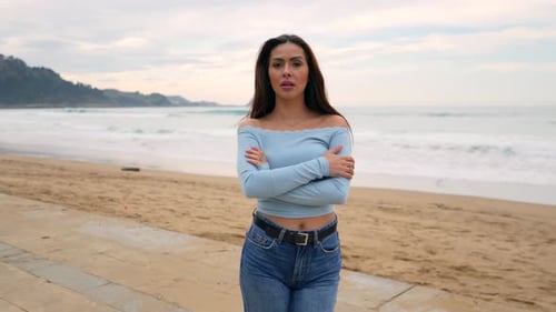 Beautiful young woman posing on the beach