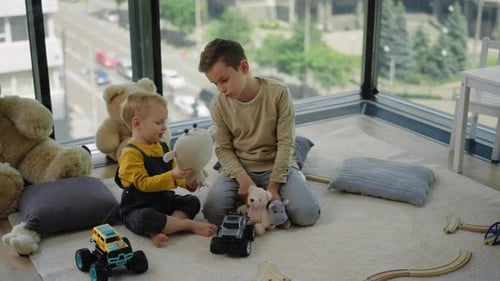 Brothers Play Together with Toys in Apartment
