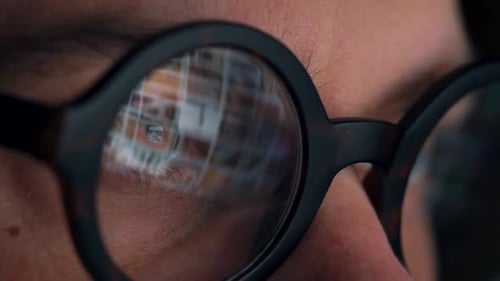 Extreme Close Up of Glasses Reflecting Computer Screen