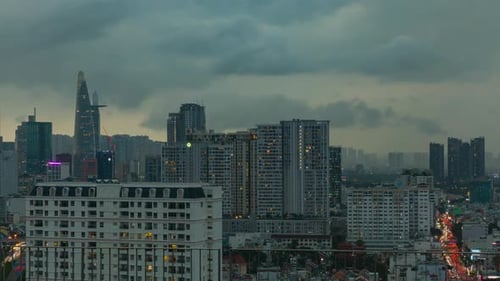 Saigon, Ho Chi Minh City, Vietnam stormy evening time lapse featuring skyline, city lights, traffic