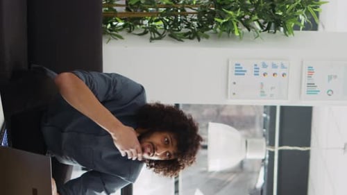 Man Working on Laptop in Bright Office