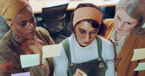 Diverse Team Collaborating on Design in Office