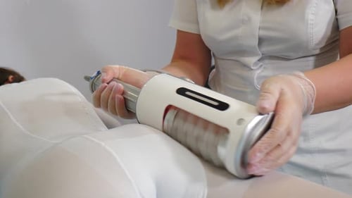 Technician Massaging Patient in Medical Setting