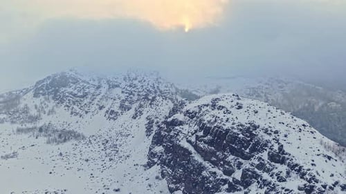 Sunny Winter Landscape on Snow Covered Mountain Slopes
