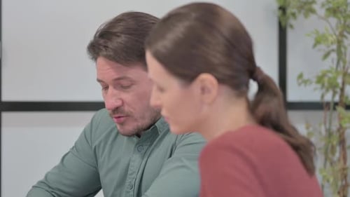 Close Up of Talking Business People Discussing Project