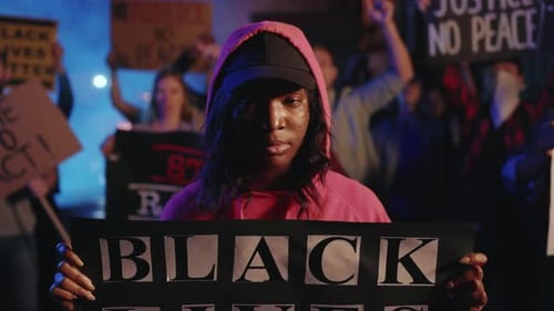 Demonstration with signs at night with protesters