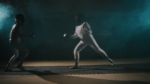 Fencing Match Between Foilswomen in Smokey Hall