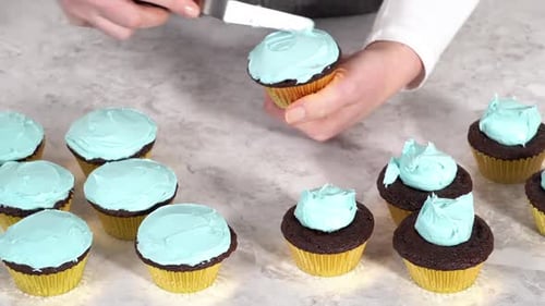 Icing Cupcakes with Light Blue Frosting at Home
