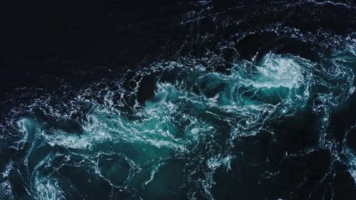 Drone Video with Birdseye View of the Abstract and Powerful Water Currents Rapids and Whirlpools of
