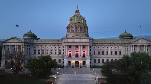 Pennsylvania Capitol Building in downtown Harrisburg, Pennsylvania. Aerial establisher rising over d