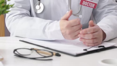 Unrecognizable Doctor Hands in White Coat Sit Table Gesturing Talking Office