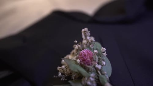 Close Up of Floral Boutonniere on Suit Jacket