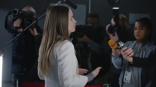 Woman Gives Interview at Press Conference