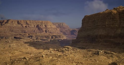 Vast and Rugged Desert Landscape Showcasing Natural Rock Formations at Dusk
