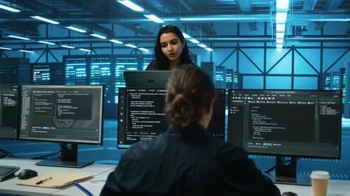 Smiling Admin in Server Hub Checking Recovery Plan Monitoring Data Center