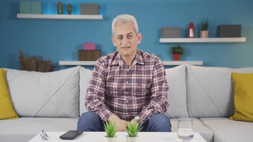 Man looking negative at camera.