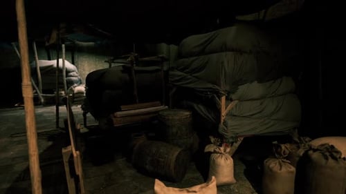 Dark Rustic Storage Area with Sacks and Barrels