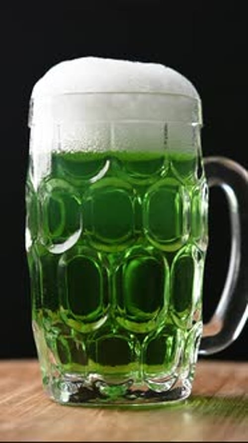 Green beer mug with foam for St. Patrick’s Day
