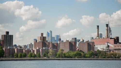 Enjoy the Impressive Manhattan Skyline View with the East River in the Background