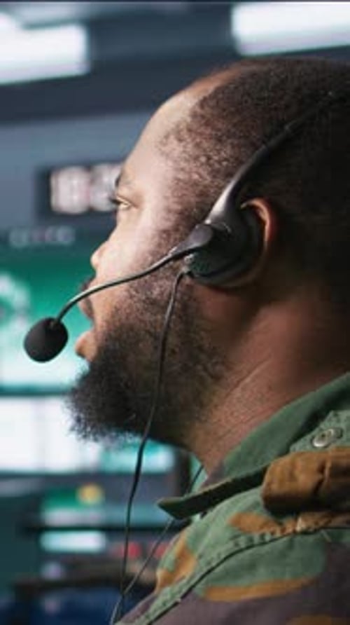 Vertical Video Army Expert Providing Intel for Troops in Base of Operations