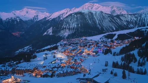 Experience the Stunning Aerial View of Nighttime Courchevel France Showcasing Its Charm