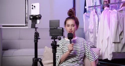 Woman Streaming Online with Camera and Microphone