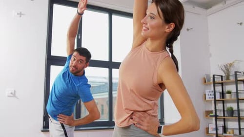 Sport, Fitness, Lifestyle And People Concept - Smiling Man And Woman Exercising At Home