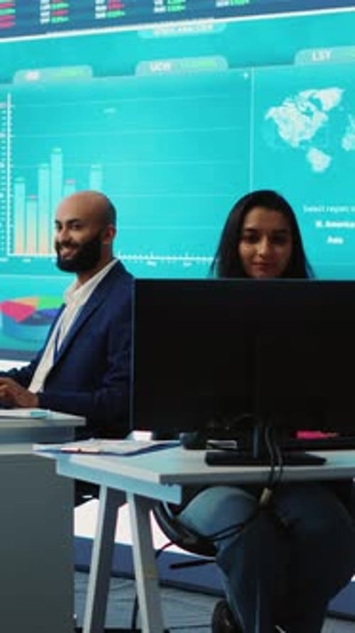 Vertical Video Forecast Affiliates Working in Coworking Space Office to Review Latest Business